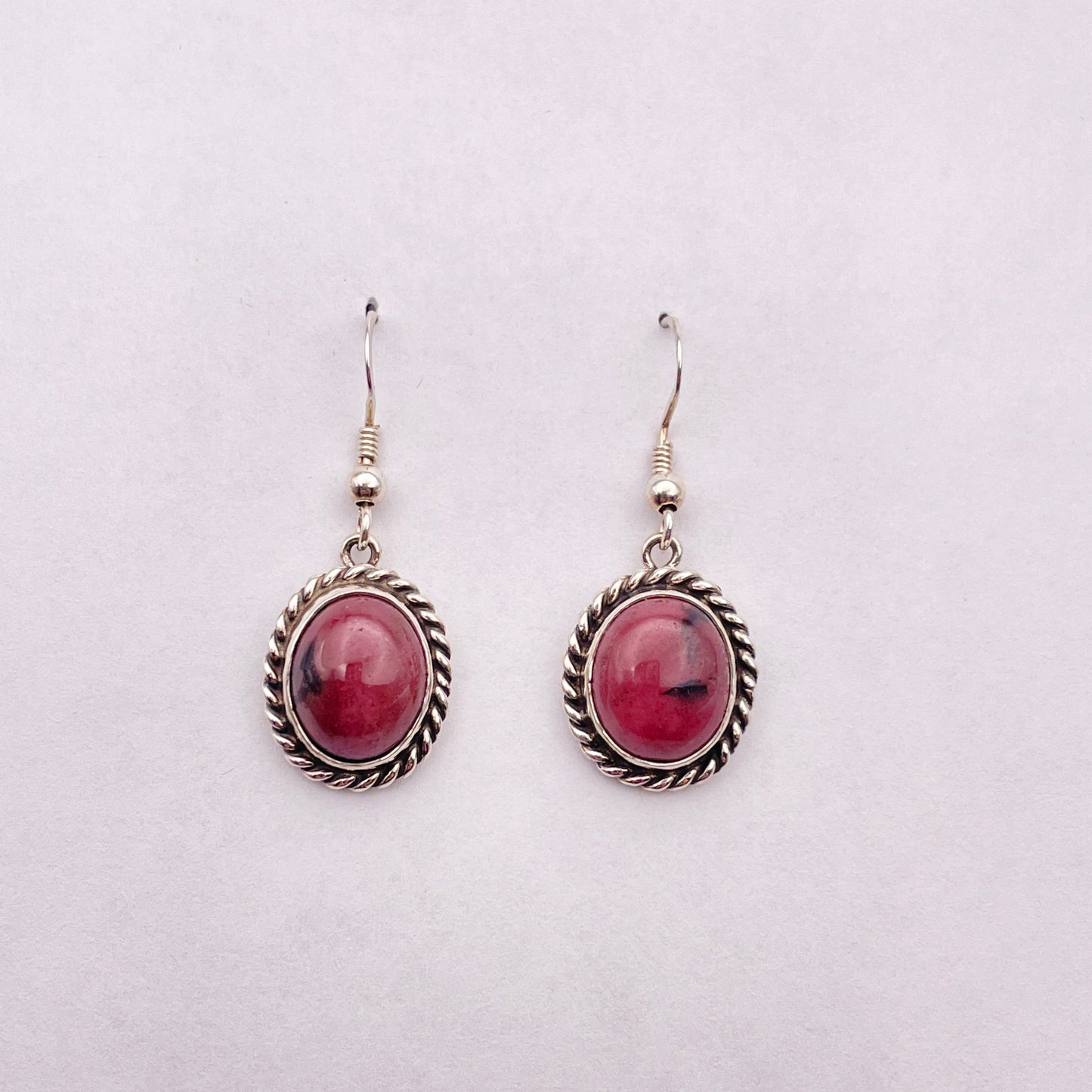 Rhodonite stones set in Sterling silver dangle earrings on French hooks