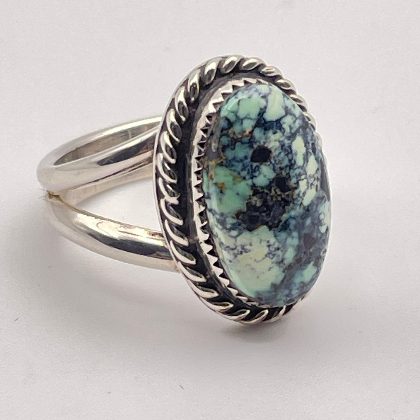 Side view of sterling silver ring set with genuine Poseidon Variscite from Nevada