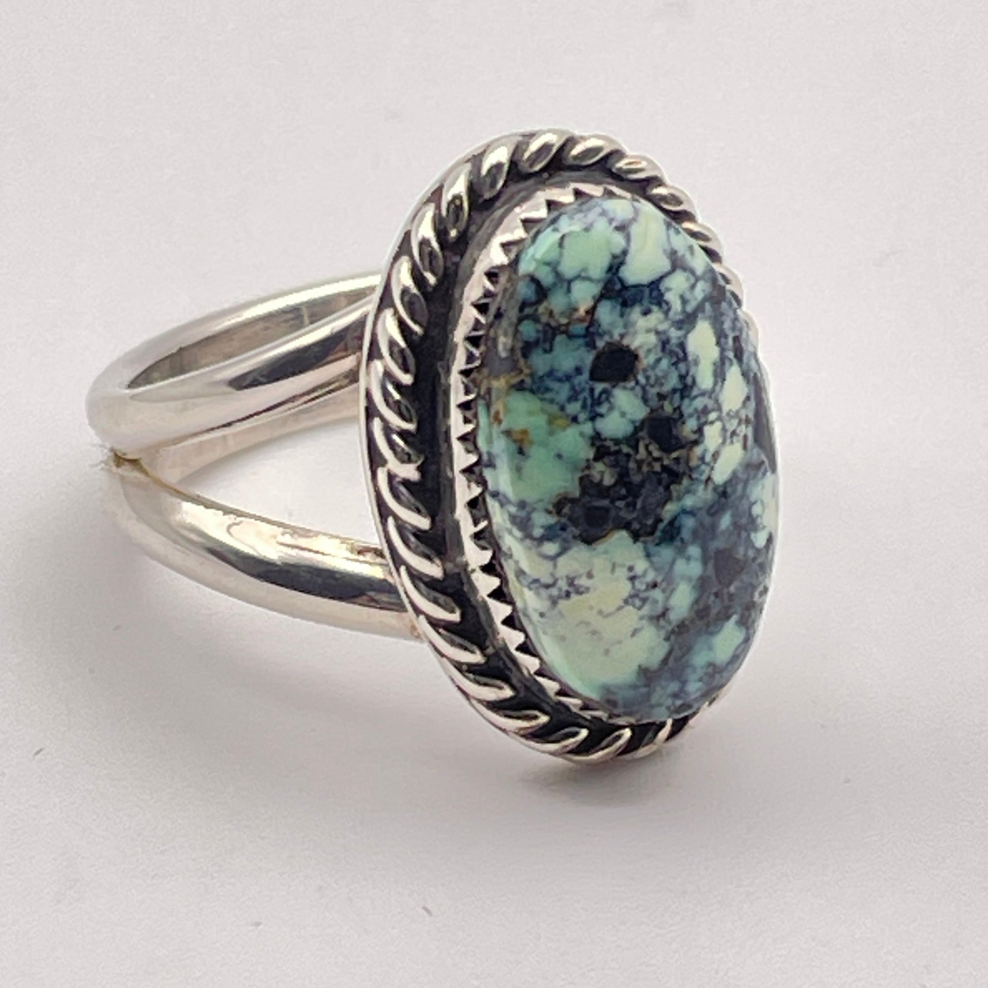 Side view of sterling silver ring set with genuine Poseidon Variscite from Nevada
