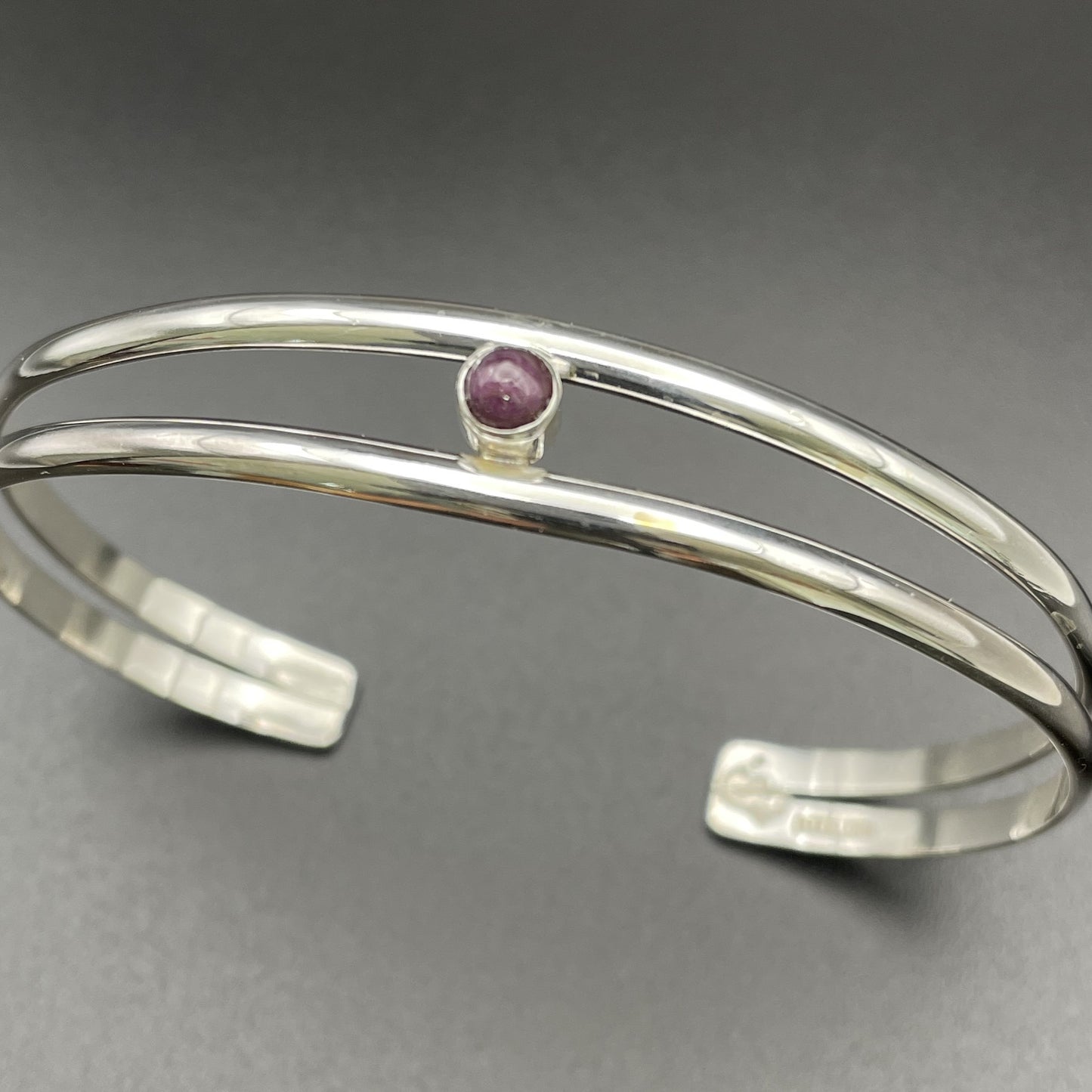 Sterling Silver lady's cuff bracelet with July's birthstone a Ruby Handmade by Arizona native artist Caleb Calles