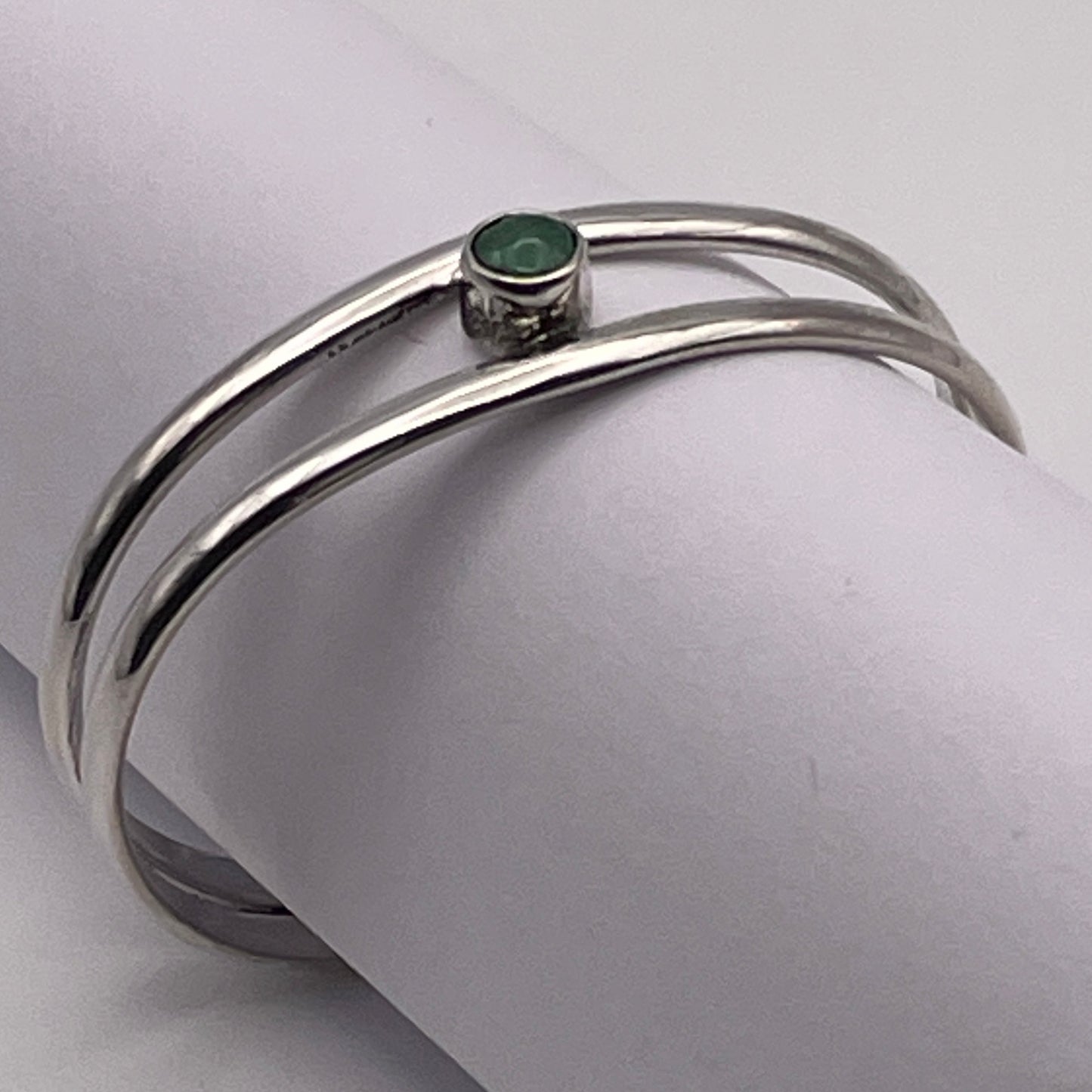 Sterling Silver baby bracelet featuring a genuine birthstone handmade by artist Caleb Calles