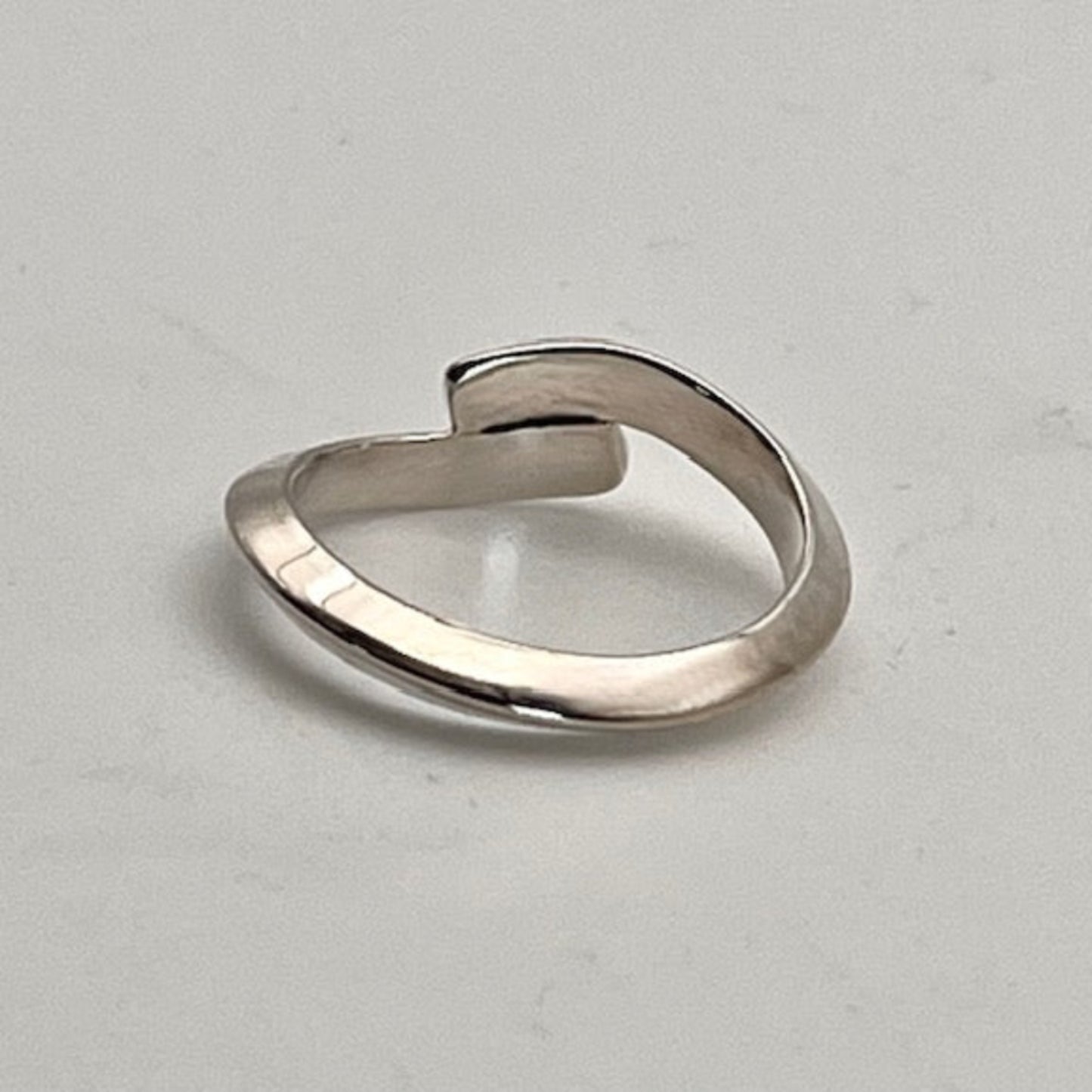 Handmade Sterling Silver ring on a light gray background